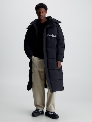 Calvin Klein Jeans Prehoden plašč 'ESSENTIALS' | črna barva