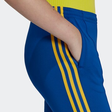 ADIDAS ORIGINALS Rozkloszowany krój Spodnie 'Adicolor 70S ' w kolorze niebieski