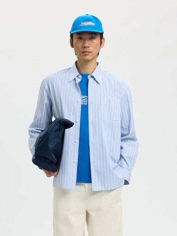 SELECTED Hætte i blå: forside