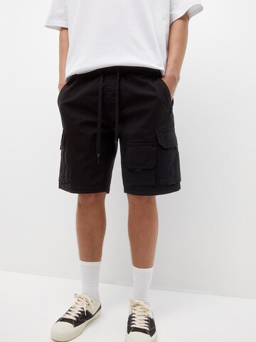 Pull&Bear Loose fit Cargo Pants in Black: front