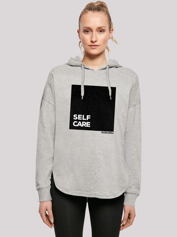 Sweat-shirt 'SELF CARE' F4NT4STIC en gris : devant