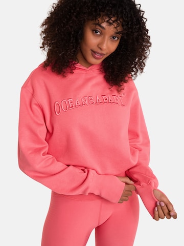 OCEANSAPART Sweatshirt 'Beverly Cropped' in Roze: voorkant