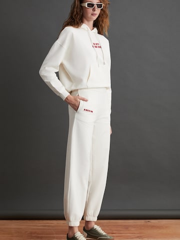 Grimelange Zúžený strih Nohavice - Béžová: predná strana