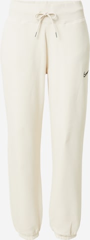 Nike Sportswear Tapered Pants in Beige: front