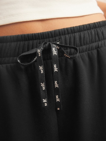 Next Wide Leg Sporthose in Schwarz