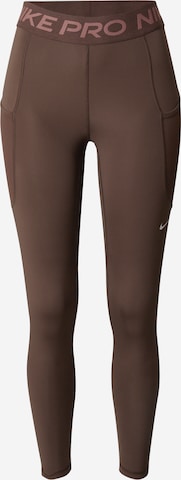 NIKE Workout Pants in Brown: front