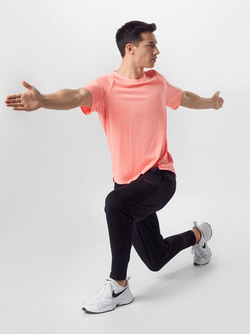 NIKE Toiminnallinen paita 'Rise 365 Run Division' värissä oranssi