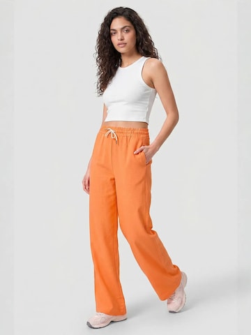 Pantalon Tommy Life en orange : devant
