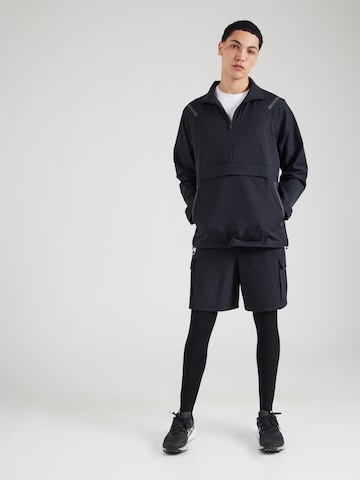 UNDER ARMOUR Bluzka sportowa 'Unstoppable' w kolorze czarny