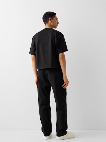 Bershka Ohlapna forma Kargo hlače | črna barva