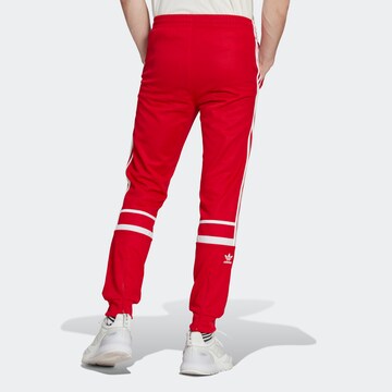 ADIDAS ORIGINALS Tapered Pants 'Adicolor Classics Cutline' in Red