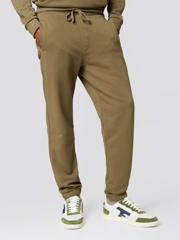 ABOUT YOU x Alvaro Soler Tapered Pants 'Matti' in Green: front