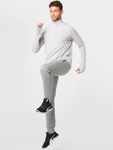 PUMA Zúžený Sportovní kalhoty 'Evostripe' – šedá