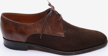 John Lobb Flats & Loafers in 45 in Brown: front