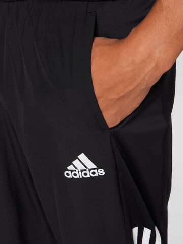 ADIDAS SPORTSWEAR Slimfit Spodnie sportowe 'Own The Run Astro Wind' w kolorze czarny