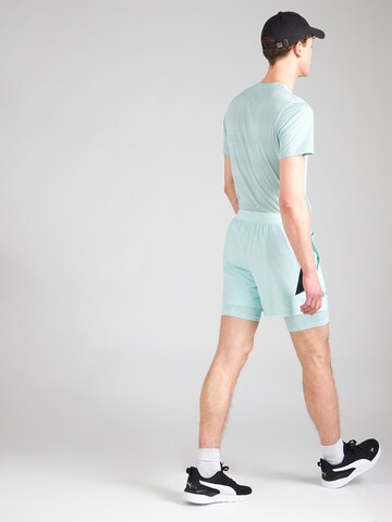 UNDER ARMOUR Regularen Športne hlače 'LAUNCH' | zelena barva