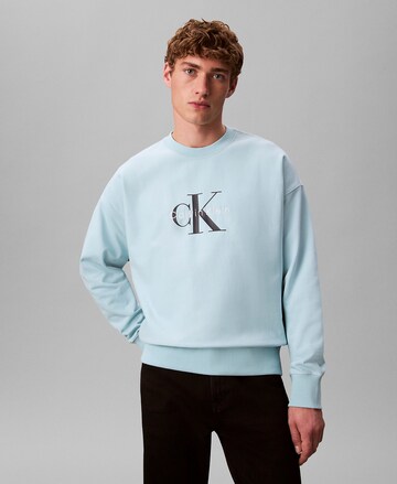 Sweat-shirt Calvin Klein Jeans en bleu : devant
