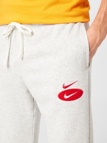 Effilé Pantalon Nike Sportswear en gris