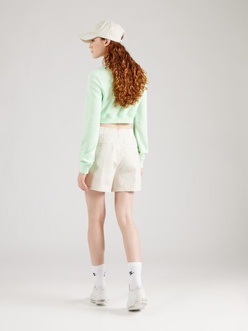 regular Pantaloni con pieghe di Nike Sportswear in beige