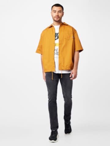 Nike Sportswear Comfort fit Button Up Shirt in Yellow