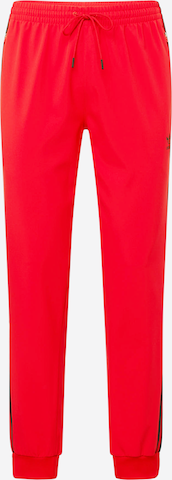 ADIDAS ORIGINALS Tapered Trousers in Red: front