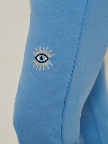 ABOUT YOU x Sofia Tsakiridou Slimfit Broek 'Tara' in Blauw