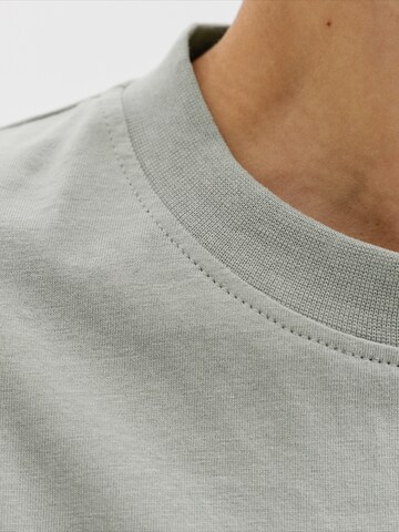 Jack & Jones Junior T-Shirt 'JORCATSKILLS' in Grün