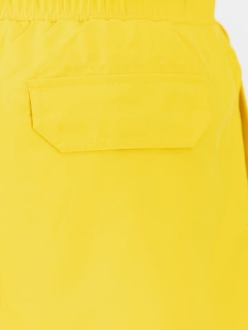 Pantaloncini da bagno di ALPHA INDUSTRIES in giallo