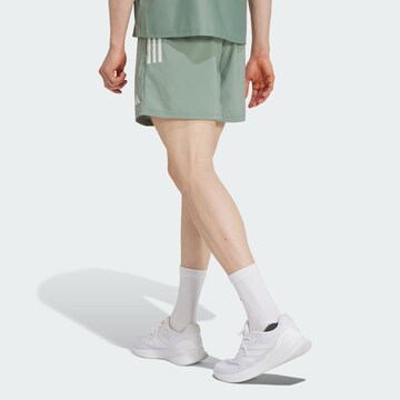 regular Pantaloni sportivi 'Own The Run' di ADIDAS PERFORMANCE in verde