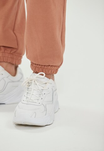 Athlecia Tapered Sportbroek 'Lia' in Bruin
