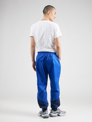 Effilé Pantalon 'Windrunner' Nike Sportswear en bleu