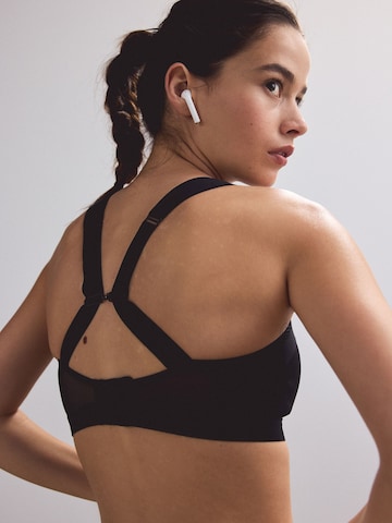 Bustino Reggiseno sportivo 'Zero Bounce' di Next in nero