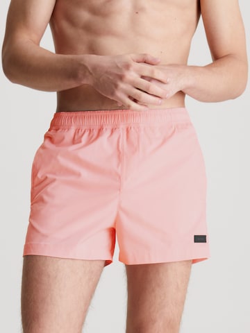 Calvin Klein Swimwear Board Shorts in Pink: front