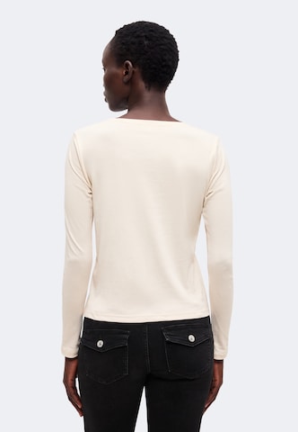 Tricou de la monari pe bej
