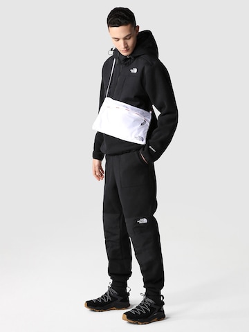 THE NORTH FACE Tapered Trousers 'DENALI' in Black: front