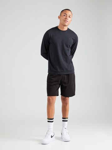 NIKE Λειτουργικό μπλουζάκι 'PRIMARY' σε μαύρο
