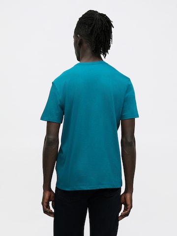 Calvin Klein Μπλουζάκι σε μπλε: πίσω