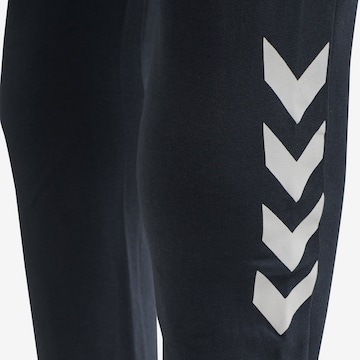 Effilé Pantalon de sport 'Legacy' Hummel en bleu