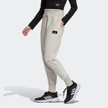 ADIDAS SPORTSWEAR Tapered Workout Pants 'Holidayz Cozy Velour' in Beige