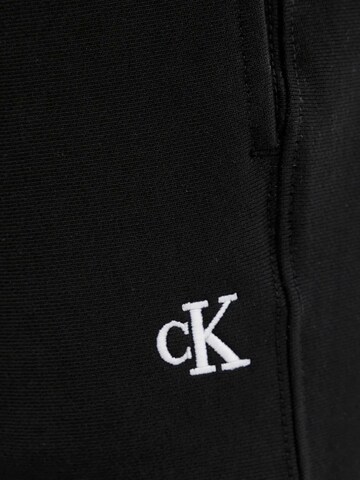 Calvin Klein Jeans Regular Sportbroek 'PREMIUM TERRY MONOGR LV04RC279G' in Zwart