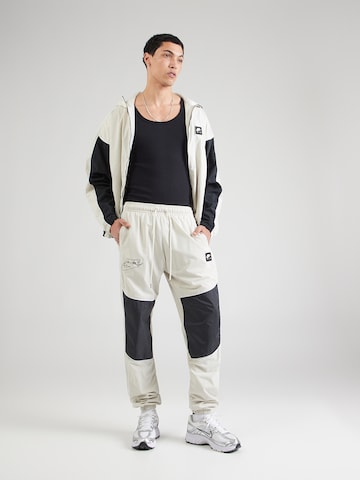 pelēks Nike Sportswear Pakapēniski sašaurināts piegriezums Bikses 'AIR'