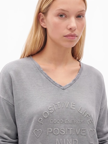 Felpa 'Positive Mind' di Zwillingsherz in grigio