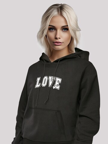 Sweat-shirt 'Love University Valentinstag Herz' F4NT4STIC en noir