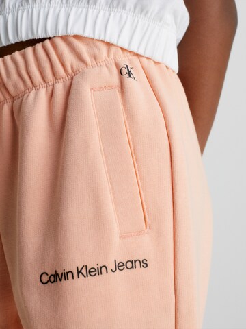 Calvin Klein Jeans Tapered Hose in Orange