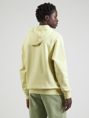 Coupe regular Sweat-shirt 'Club Fleece' Nike Sportswear en jaune : derrière