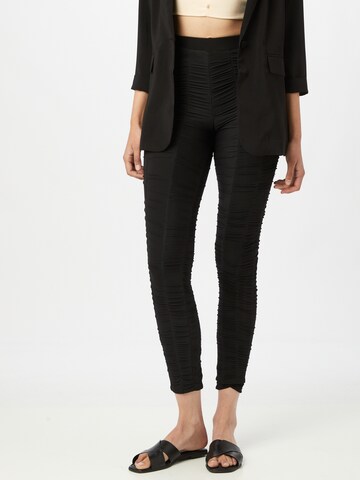 CLUB L LONDON Skinny Leggings in Black: front