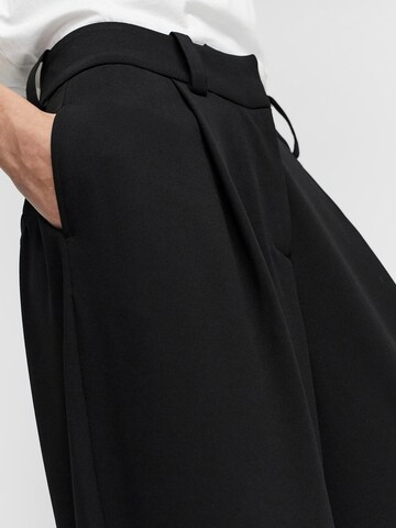 VERO MODA - Pierna ancha Pantalón plisado 'Gigi' en negro