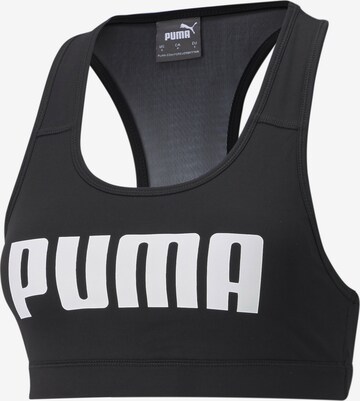 Reggiseno sportivo di PUMA in nero: frontale