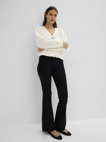 bonprix Levenevä Leggingsit värissä musta