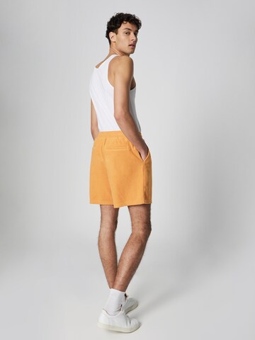 ABOUT YOU x Jaime Lorente Regular Pants 'Leon' in Orange